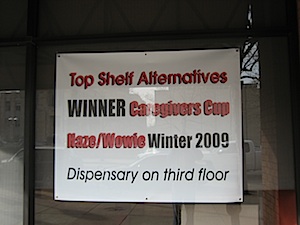 Sign on front of building at Top Shelf Alternatives
